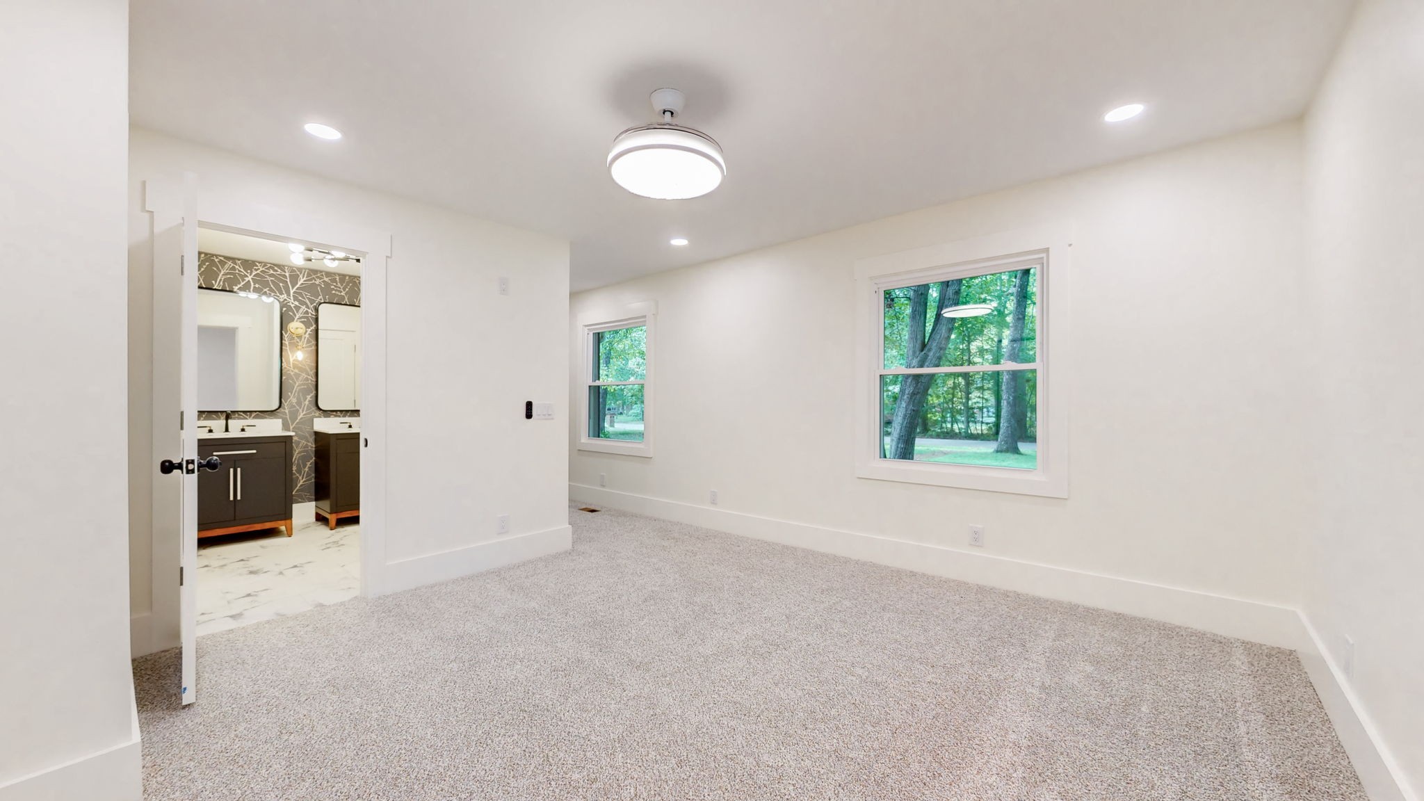 196 Thomas Street Manchester, TN 37355 - Photo 24 of 43 en empty room with window and a chandelier