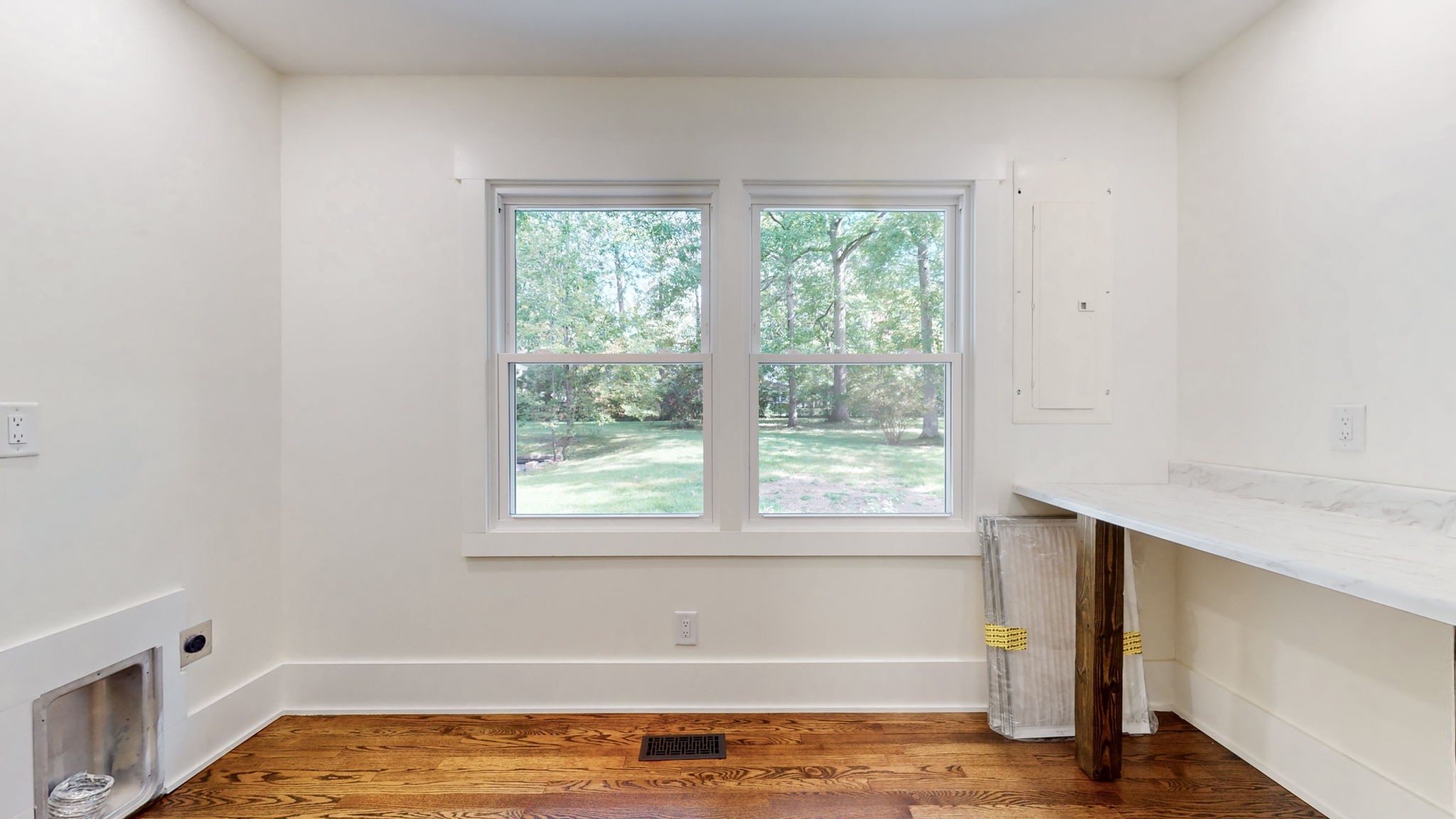 196 Thomas Street Manchester, TN 37355 - Photo 27 of 43 a view of an empty room with wooden floor and a window