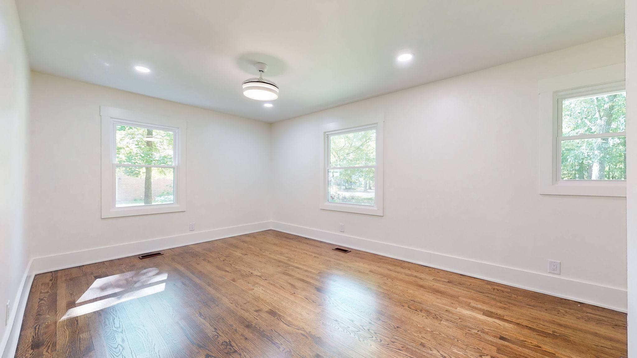 196 Thomas Street Manchester, TN 37355 - Photo 30 of 43 an empty room with wooden floor and windows