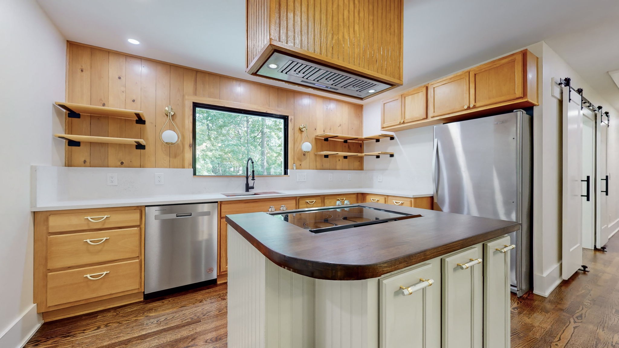 196 Thomas Street Manchester, TN 37355 - Photo 10 of 43 a kitchen with stainless steel appliances granite countertop a sink a refrigerator and wooden cabinets
