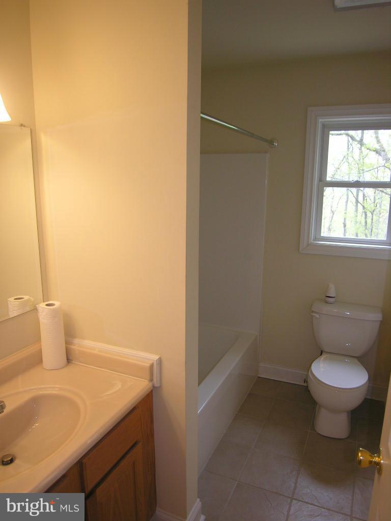849 Valley View Road Harpers Ferry, WV 25425 - Photo 15 of 29 a bathroom with a sink toilet and window