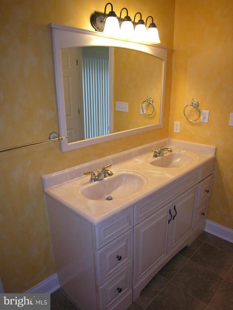 849 Valley View Road Harpers Ferry, WV 25425 - Photo 19 of 29 a bathroom with a sink and a mirror