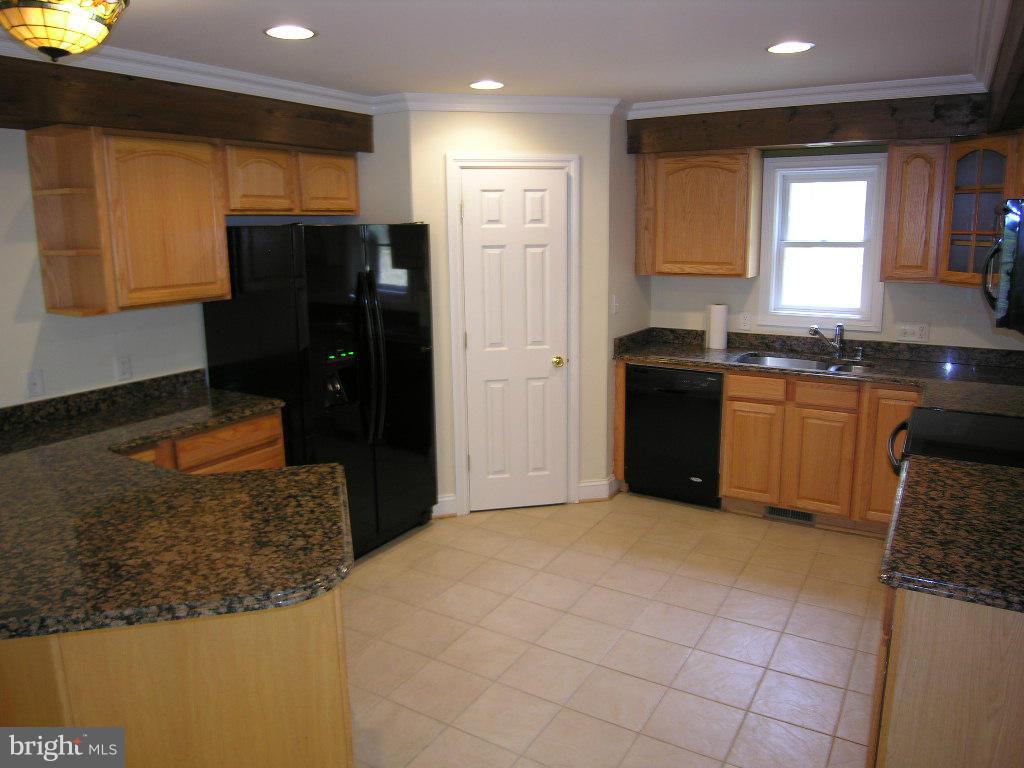 849 Valley View Road Harpers Ferry, WV 25425 - Photo 10 of 29 a kitchen with stainless steel appliances granite countertop a refrigerator and a stove top oven