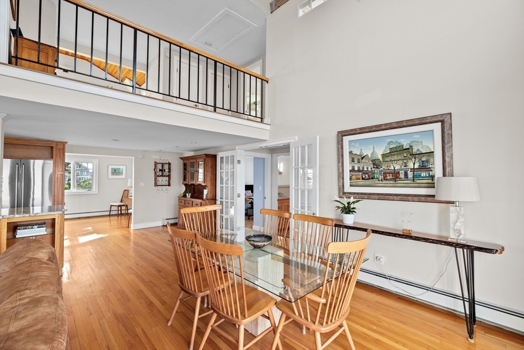 45 Rebecca Road Scituate, MA 02066 - Photo 11 of 36 a view of a dining room with furniture wooden floor and a rug