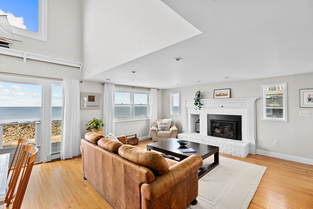 45 Rebecca Road Scituate, MA 02066 - Photo 15 of 36 a living room with furniture and a fireplace