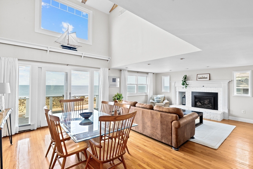 45 Rebecca Road Scituate, MA 02066 - Photo 16 of 36 a living room with furniture a fireplace and a table