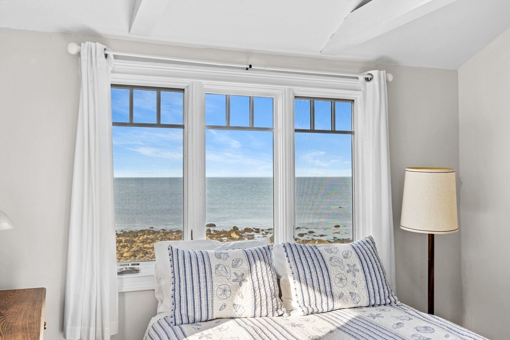 45 Rebecca Road Scituate, MA 02066 - Photo 25 of 36 a bedroom with a bed and a window