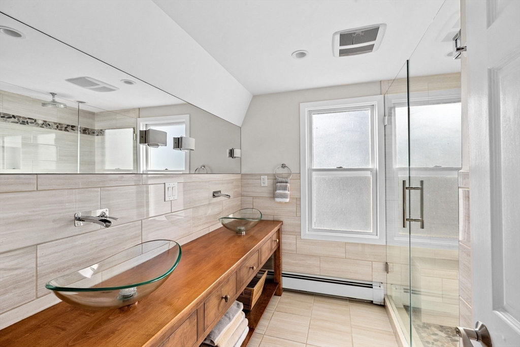 45 Rebecca Road Scituate, MA 02066 - Photo 26 of 36 a bathroom with a tub and shower