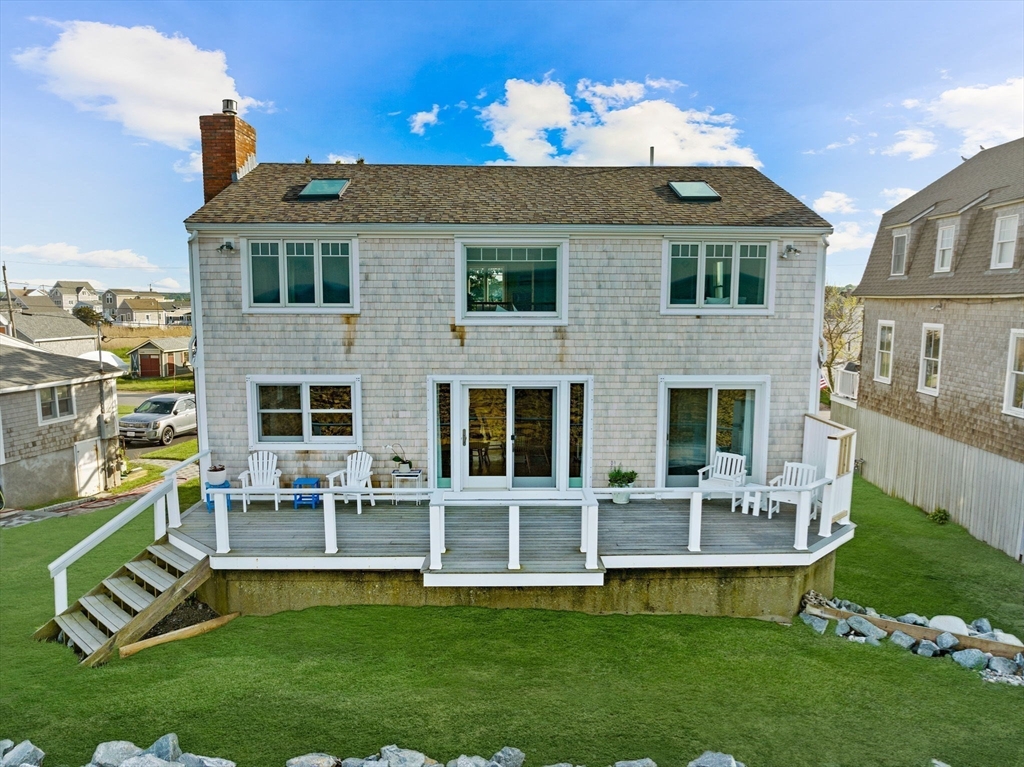 45 Rebecca Road Scituate, MA 02066 - Photo 33 of 36 a front view of a house with a garden and swimming pool