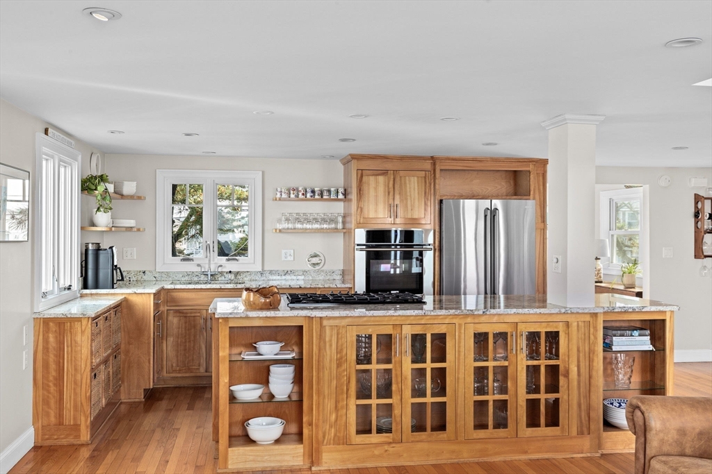 45 Rebecca Road Scituate, MA 02066 - Photo 7 of 36 a kitchen with stainless steel appliances granite countertop a stove and cabinets