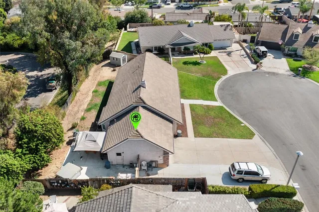 an aerial view of a house with a garden