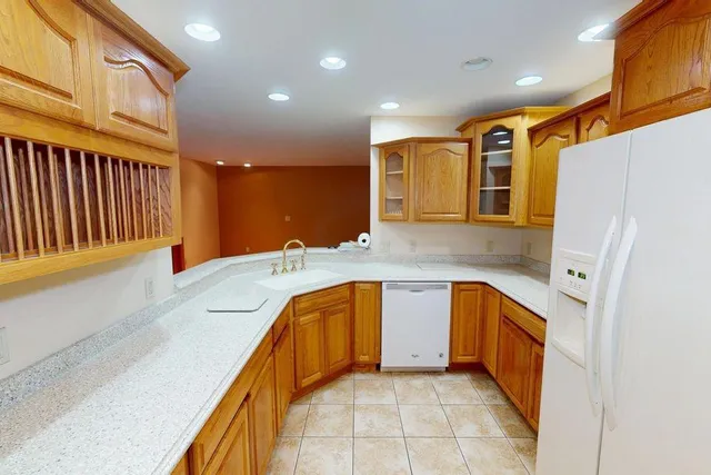 a en suite bathroom with a sink double vanity and a tub