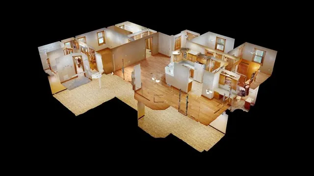 a white bed sitting in a bedroom next to a lamp