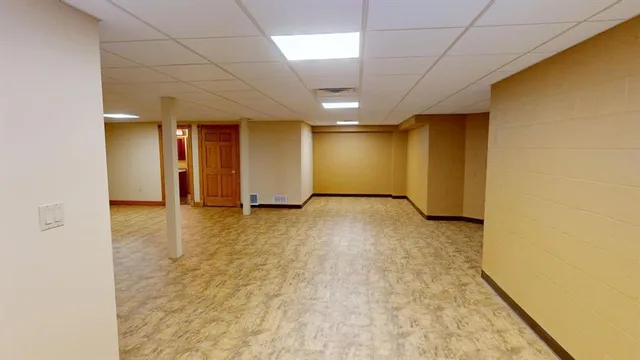 a view of an empty room with stairs