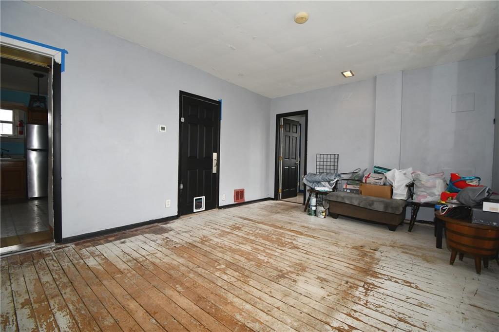 17 Dean Street Carnegie, PA 15106 - Photo 4 of 23 a bedroom with furniture and a wooden floor