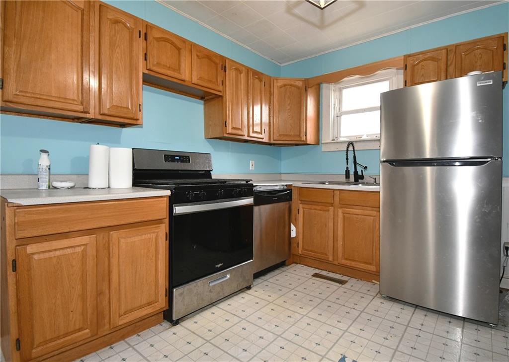 17 Dean Street Carnegie, PA 15106 - Photo 8 of 23 a kitchen with stainless steel appliances granite countertop a refrigerator sink and cabinets