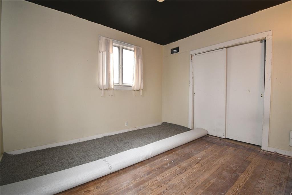 17 Dean Street Carnegie, PA 15106 - Photo 9 of 23 a view of an empty room with wooden floor and a window