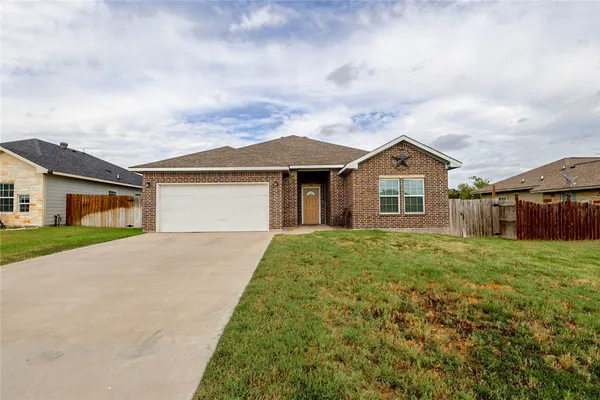 front view of a house and a yard