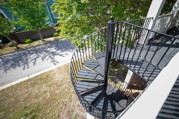 a view of a balcony with wooden floor
