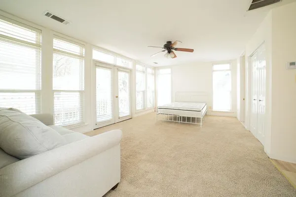 a living room with furniture and windows
