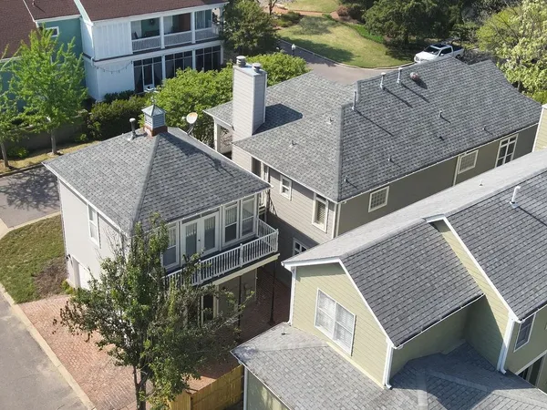 a aerial view of a house with a yard