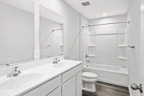 a bathroom with a sink a toilet and a bathtub