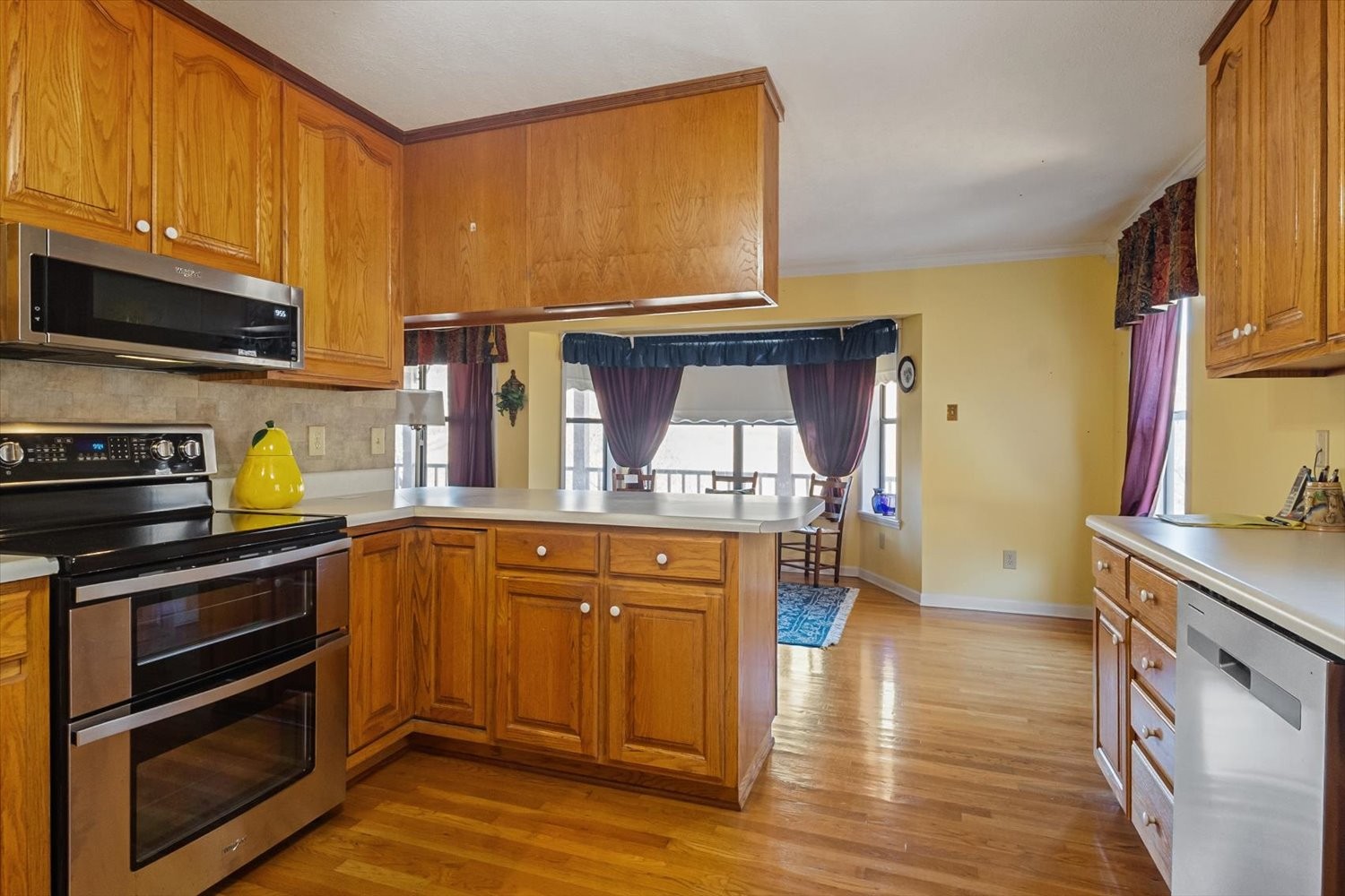 3885 Delina Road Cornersville, TN 37047 - Photo 19 of 67 a kitchen with stainless steel appliances a stove a sink and cabinets