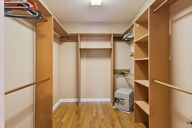 a bathroom with a sink a toilet and a large mirror