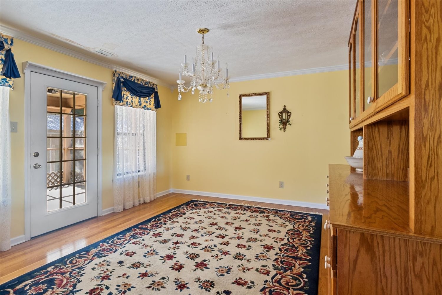 3885 Delina Road Cornersville, TN 37047 - Photo 23 of 67 a view of a hallway with windows and chandelier