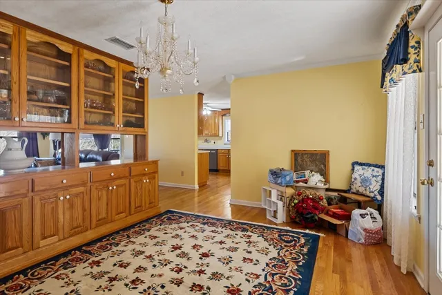 a view of hallway with wooden floor