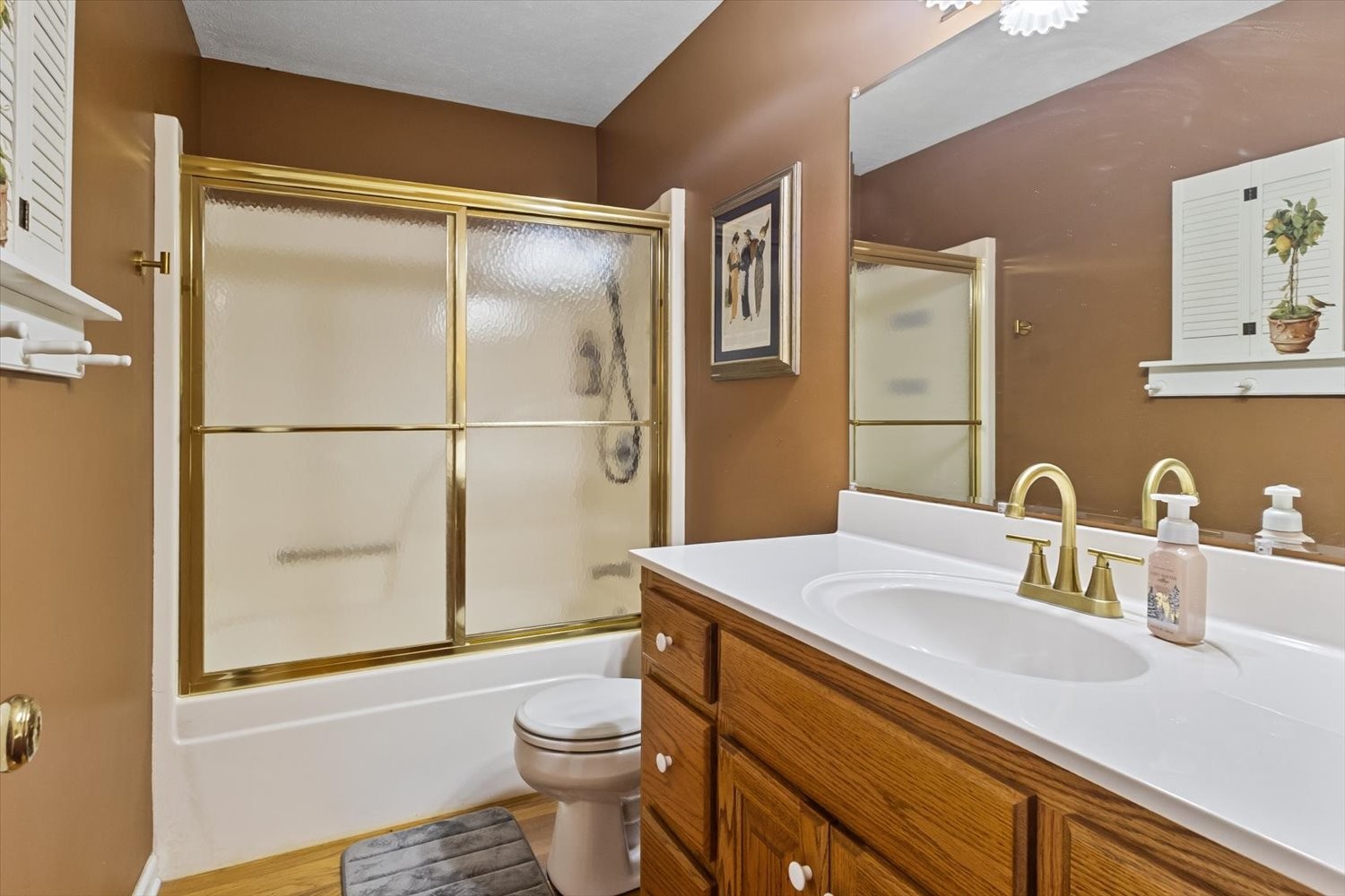 3885 Delina Road Cornersville, TN 37047 - Photo 25 of 67 a bathroom with a sink a toilet and a large mirror