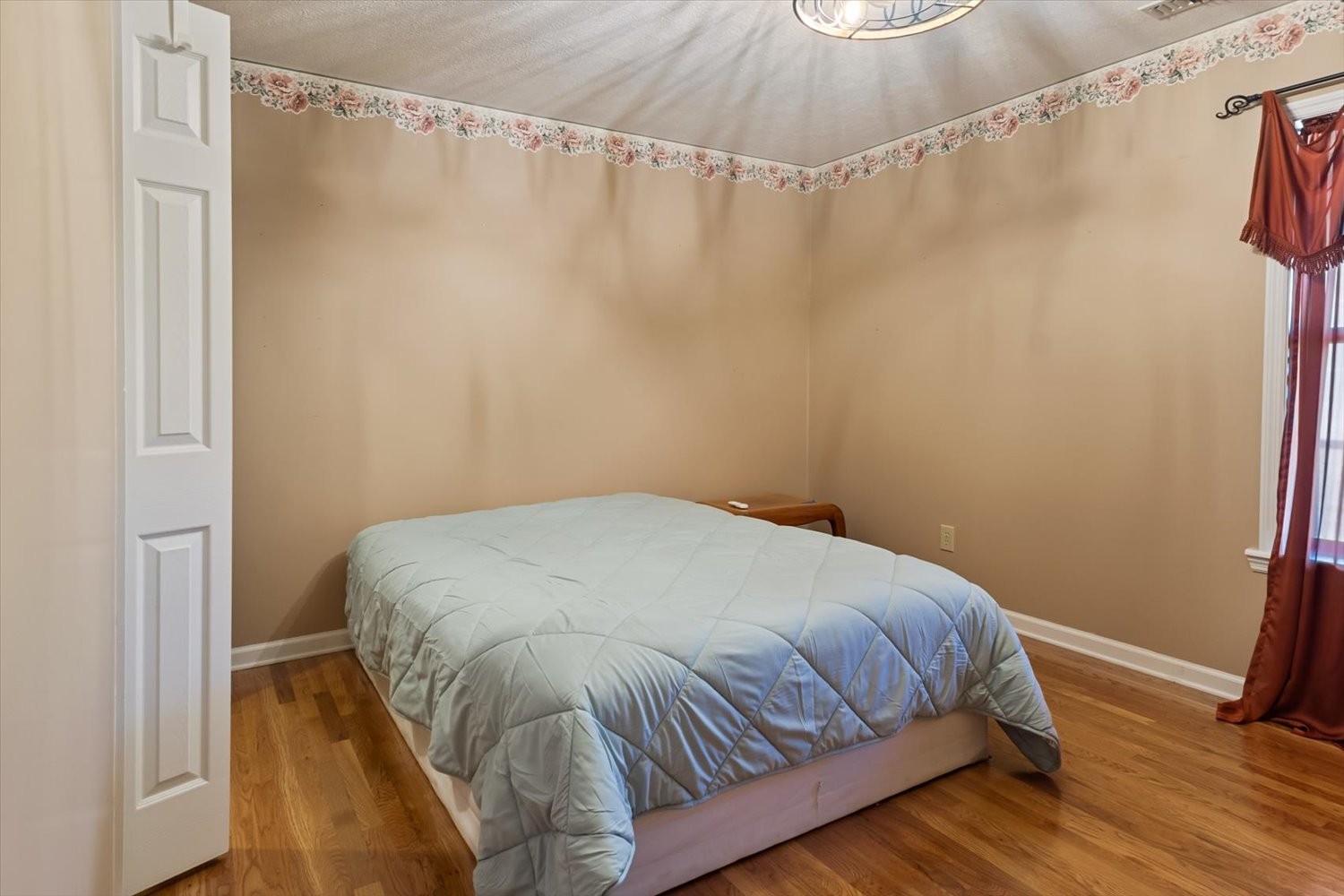 3885 Delina Road Cornersville, TN 37047 - Photo 29 of 67 a bedroom with a bed and a mirror