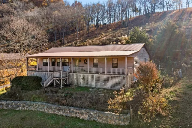 a view of a yard with wooden floor and lake view