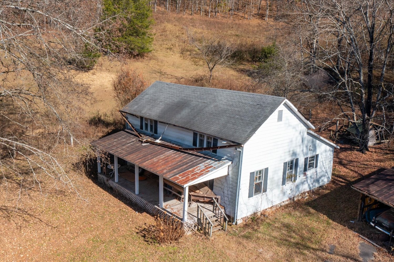 3885 Delina Road Cornersville, TN 37047 - Photo 59 of 67 an aerial view of a house with roof deck front of house