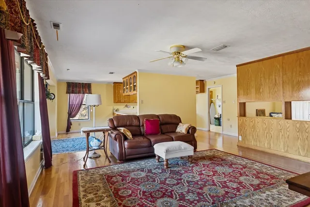a living room with furniture and a rug