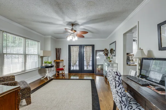 a living room with furniture fireplace and flat screen tv