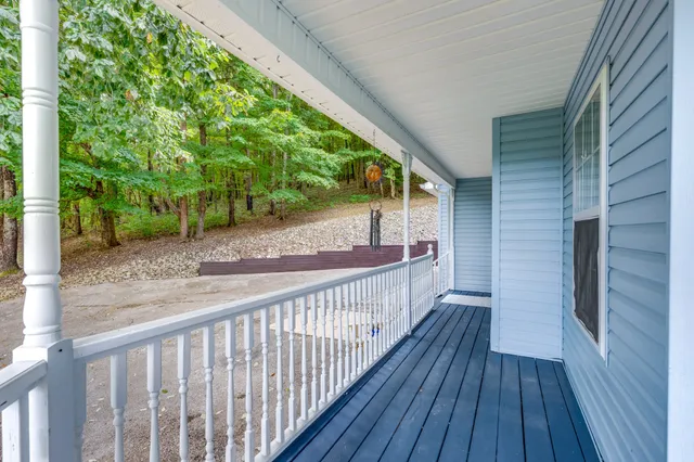 a view of a house with a garden and swimming pool
