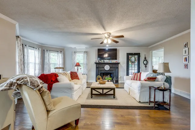 a view of entryway with livingroom and windows