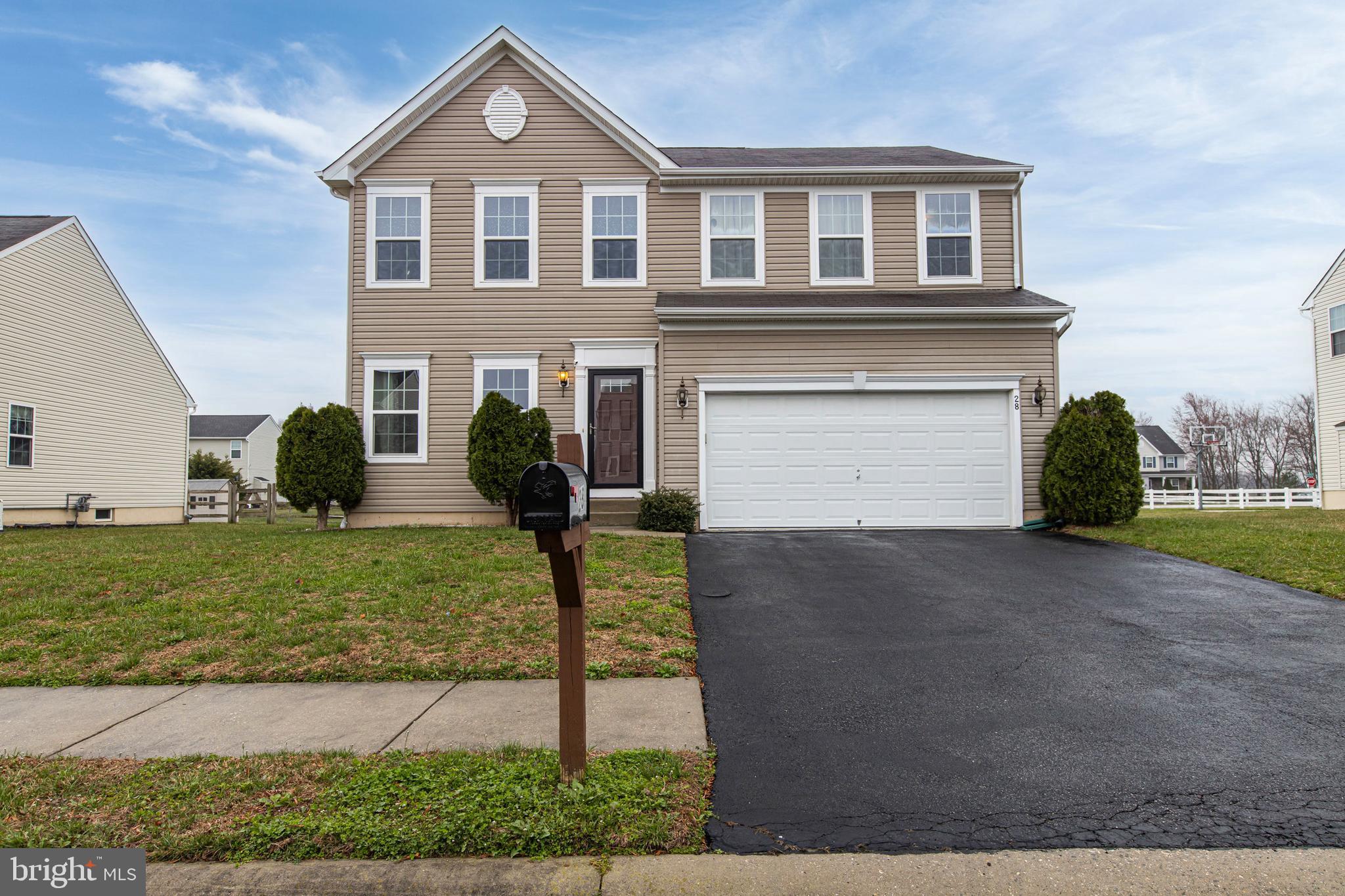 28 Snow Branch Road Clayton, DE 19938 - Photo 1 of 69 a front view of a house with a yard and garage