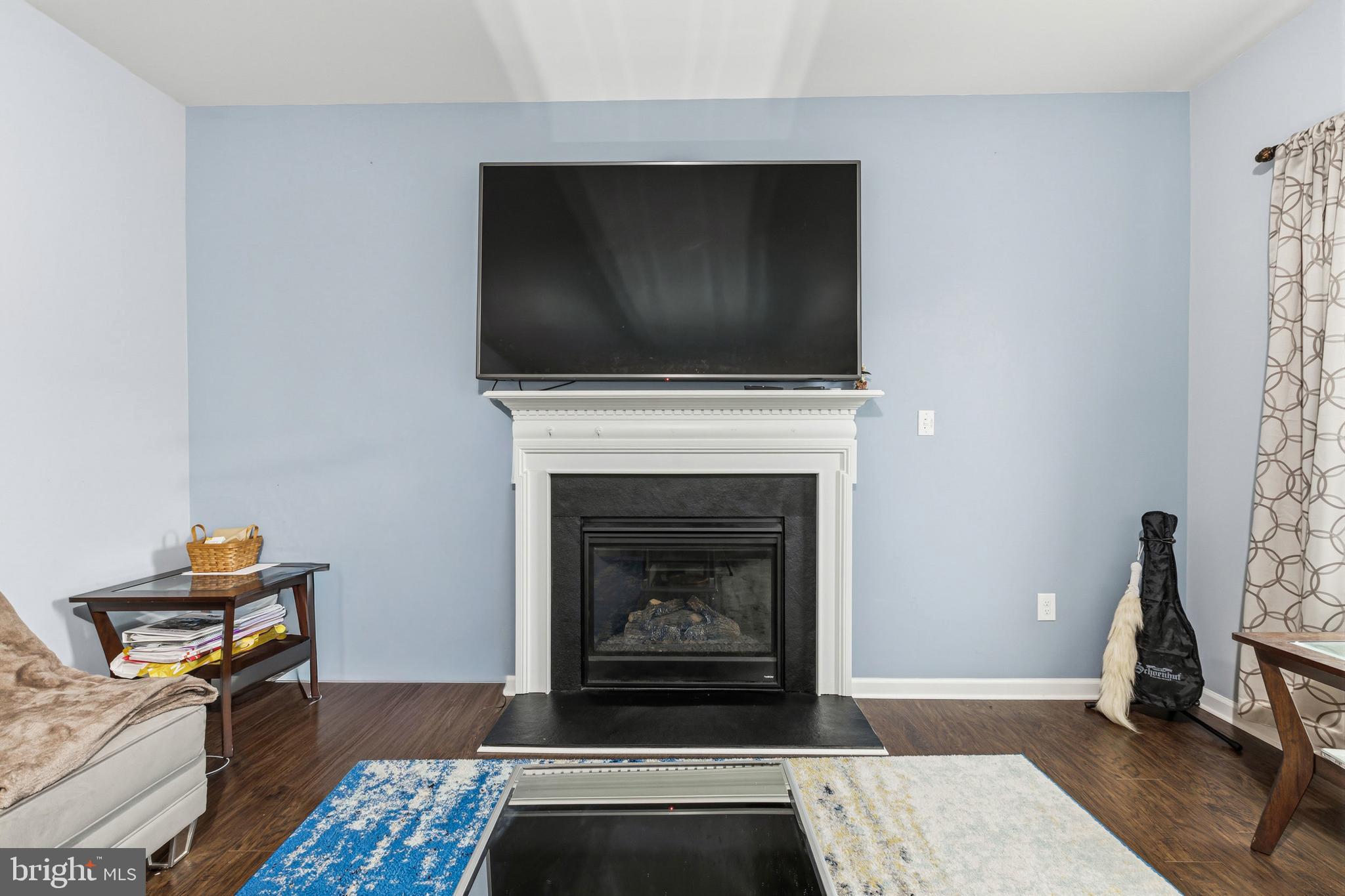 28 Snow Branch Road Clayton, DE 19938 - Photo 15 of 69 a living room with furniture and a fireplace