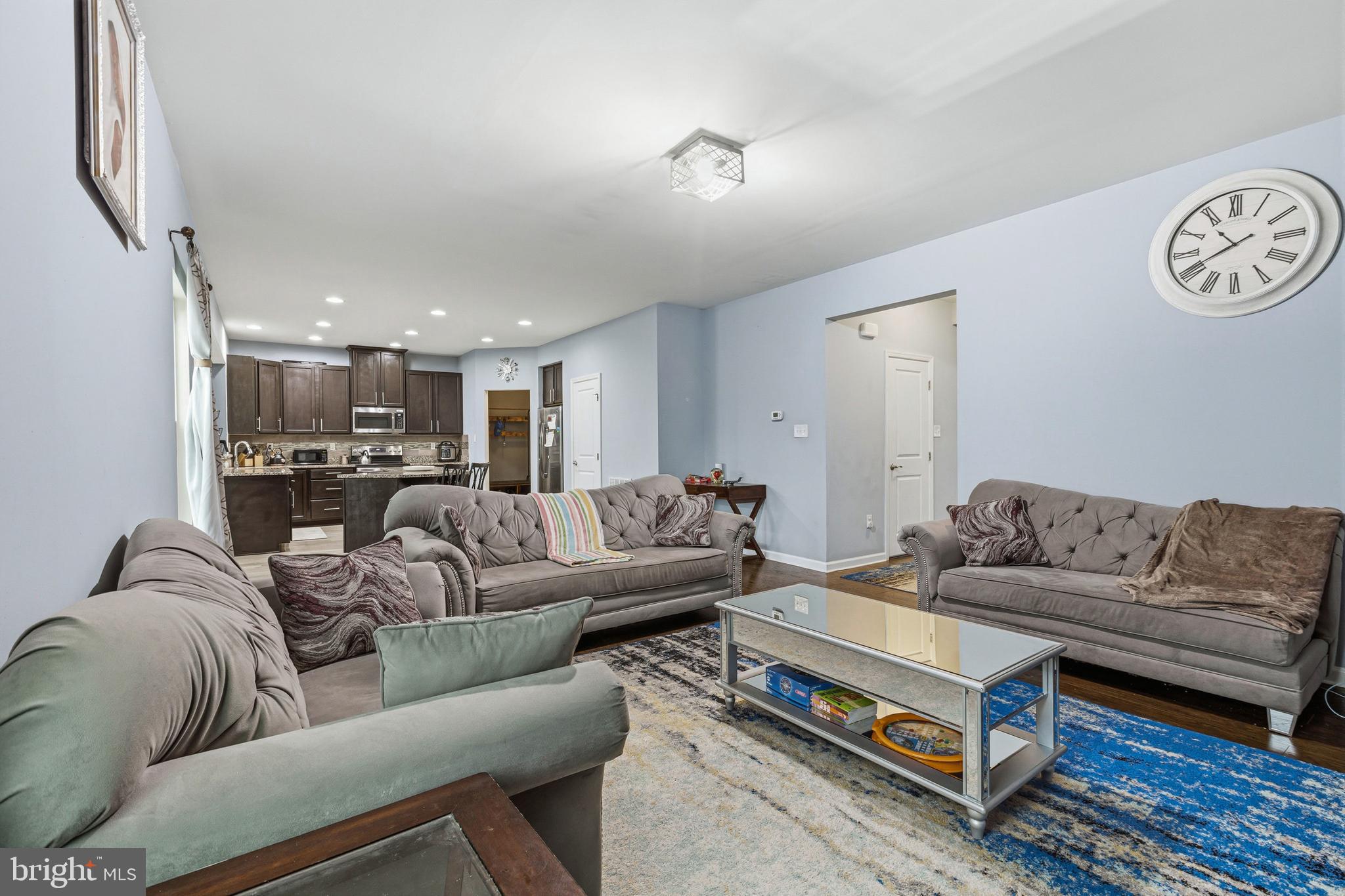 28 Snow Branch Road Clayton, DE 19938 - Photo 16 of 69 a living room with furniture ceiling fan and a rug