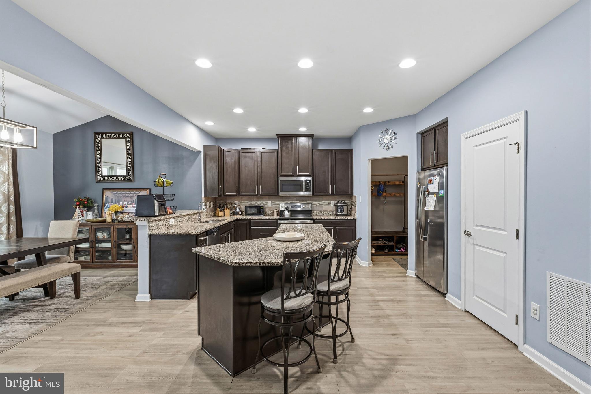 28 Snow Branch Road Clayton, DE 19938 - Photo 18 of 69 a large kitchen with a table and chairs