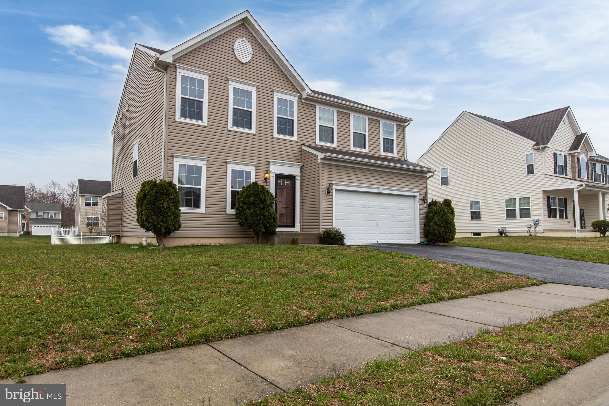 28 Snow Branch Road Clayton, DE 19938 - Photo 2 of 69 a front view of a house with a garden
