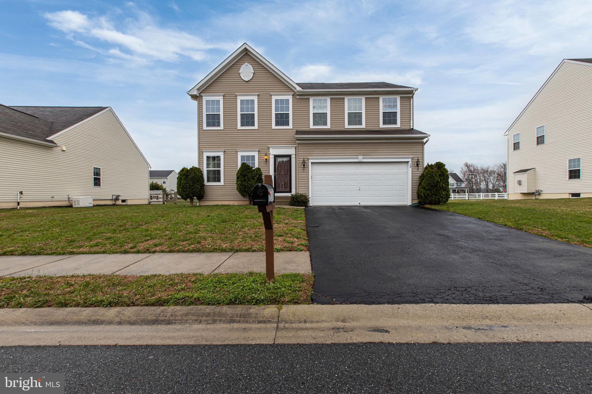 28 Snow Branch Road Clayton, DE 19938 - Photo 3 of 69 a front view of a house with a yard and garage