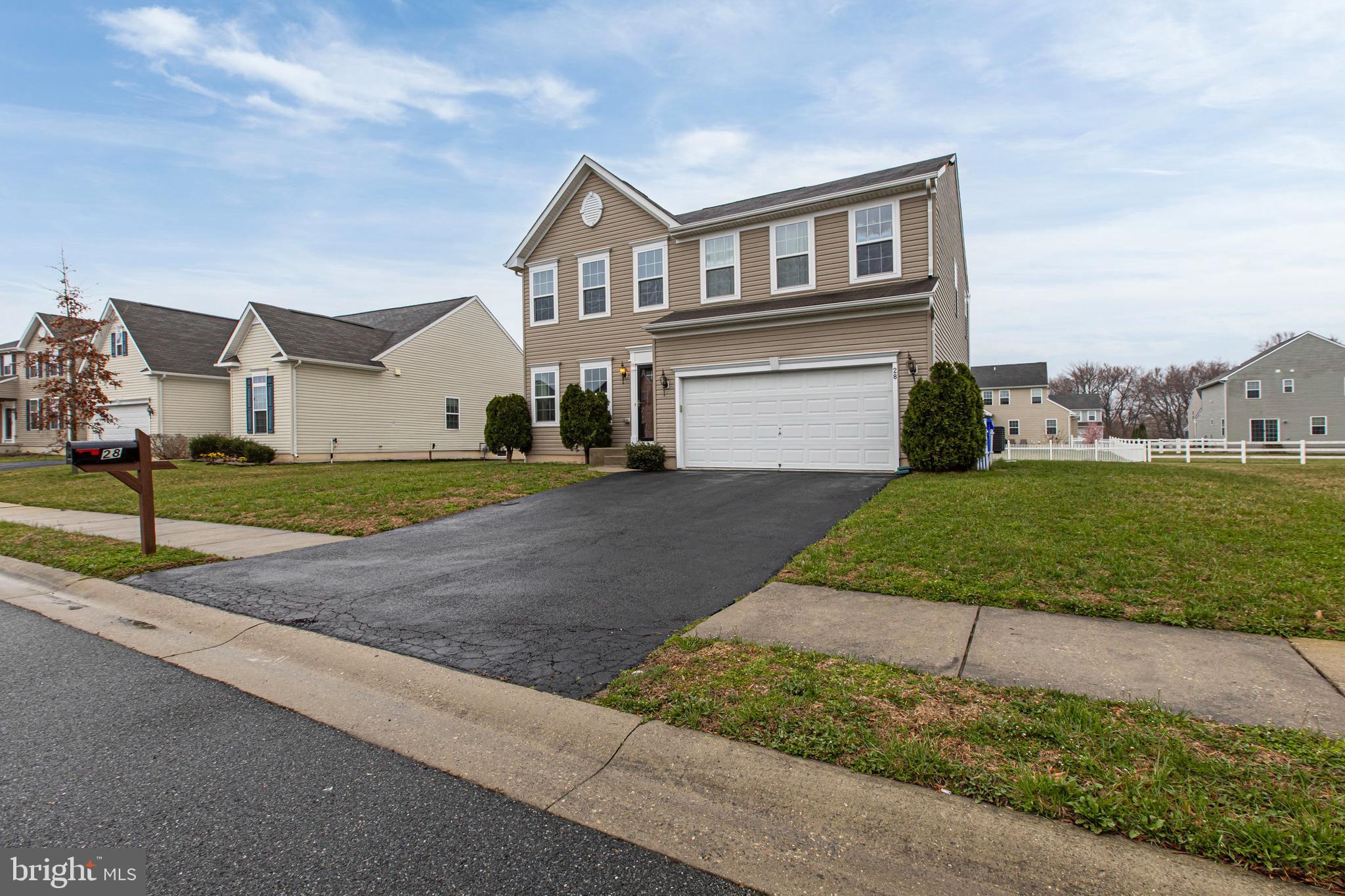 28 Snow Branch Road Clayton, DE 19938 - Photo 4 of 69 a front view of a house with a yard and garage