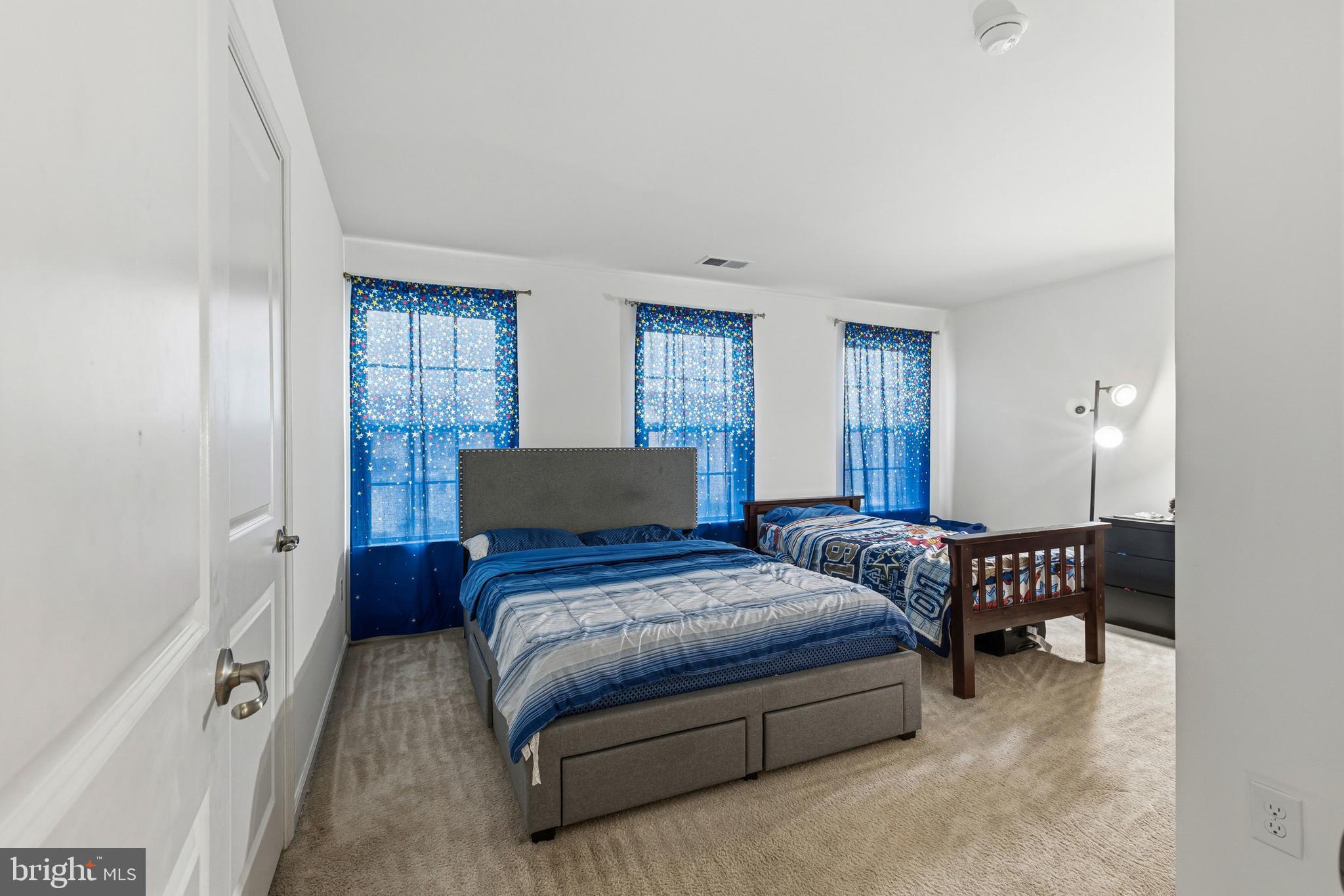 28 Snow Branch Road Clayton, DE 19938 - Photo 46 of 69 a bedroom with a bed couch and a window