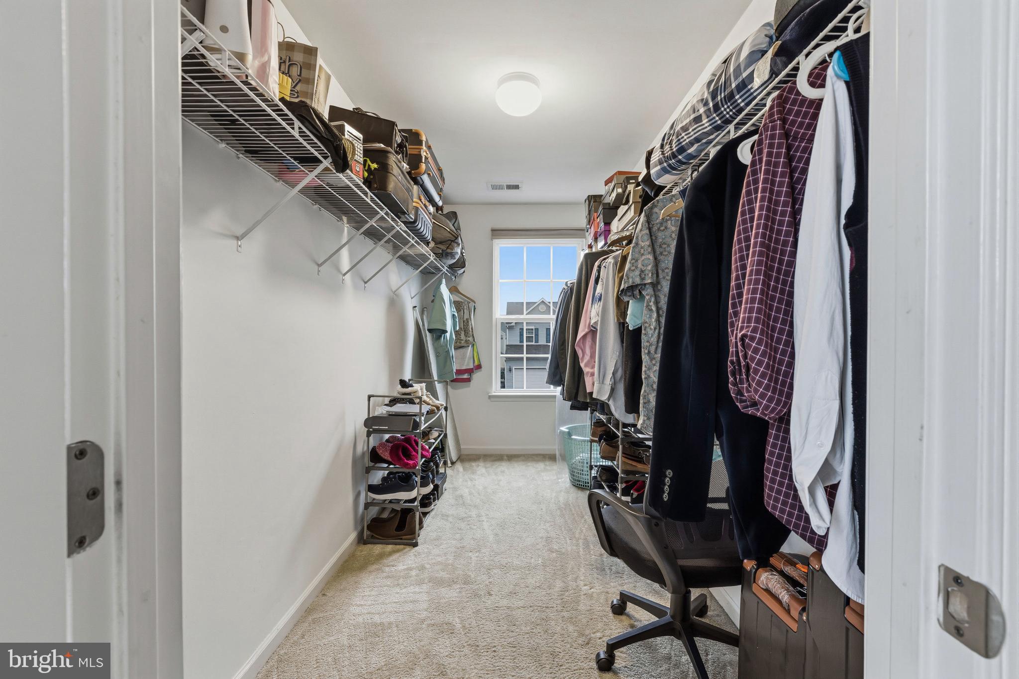 28 Snow Branch Road Clayton, DE 19938 - Photo 53 of 69 a view of walk in closet with clothes