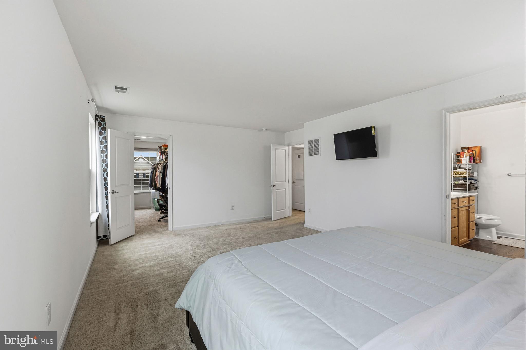 28 Snow Branch Road Clayton, DE 19938 - Photo 55 of 69 a bedroom with a bed and a flat screen tv