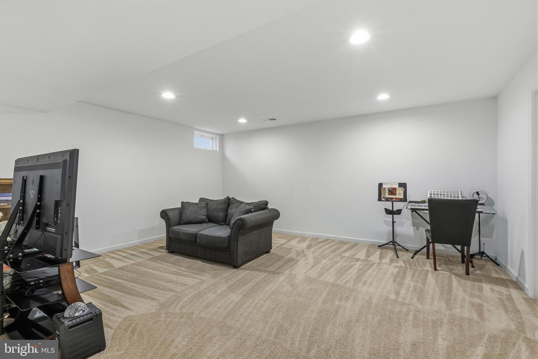 28 Snow Branch Road Clayton, DE 19938 - Photo 63 of 69 a livingroom with furniture and a gym cycle