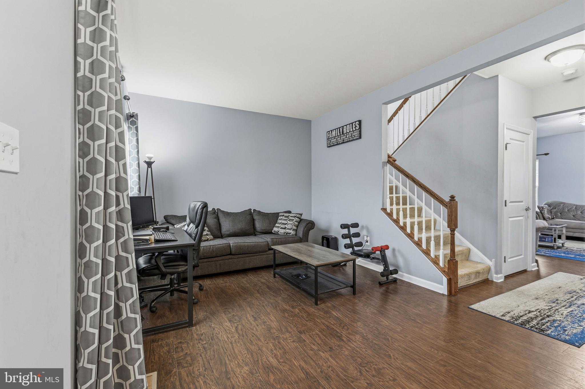 28 Snow Branch Road Clayton, DE 19938 - Photo 9 of 69 a living room with furniture and a wooden floor